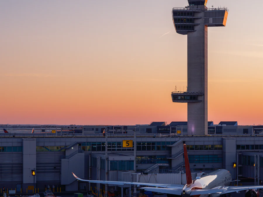 Airport control tower against a sunset sky