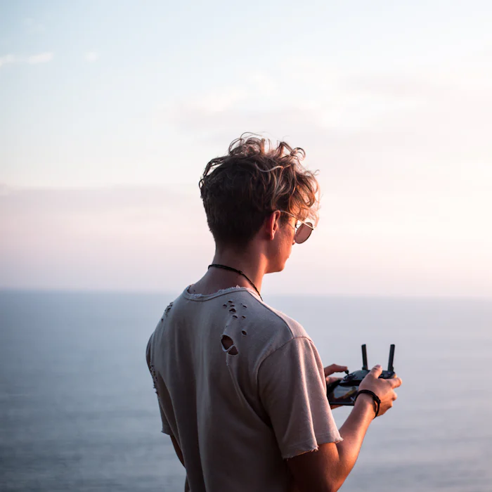 Operator flying a drone on the coast in Bali