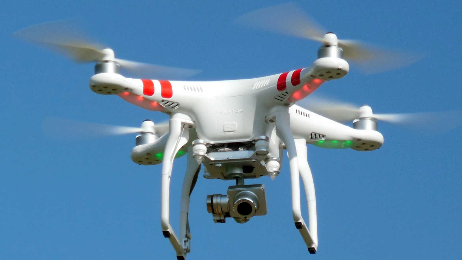 Quadcopter hovering overhead, illustrating privacy risks and penalties under Bali drone law
