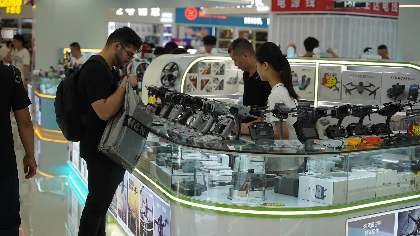Rows of camera drones on display, illustrating cost scenarios for Bali drone permits