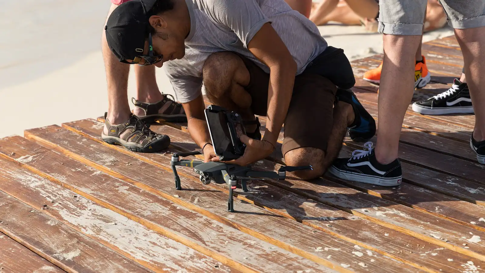 Content creator launching a compact camera drone, subject to Bali drone compliance rules
