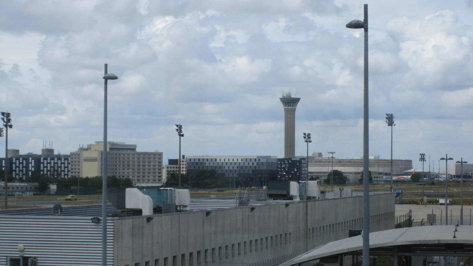 Air traffic control tower against the sky, representing U-space drone traffic management